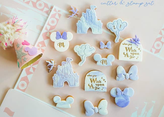 disney-shaped cookie cutters with fondant decorations embossed on top