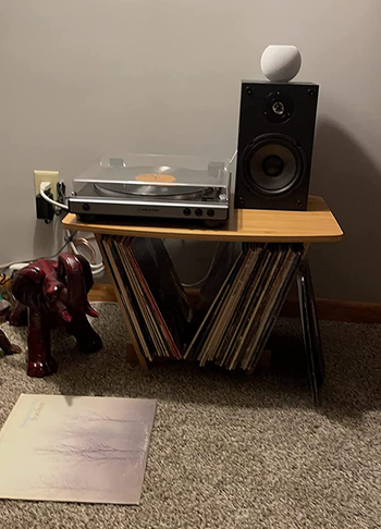 Reviewer image of product with record player on top next to speaker