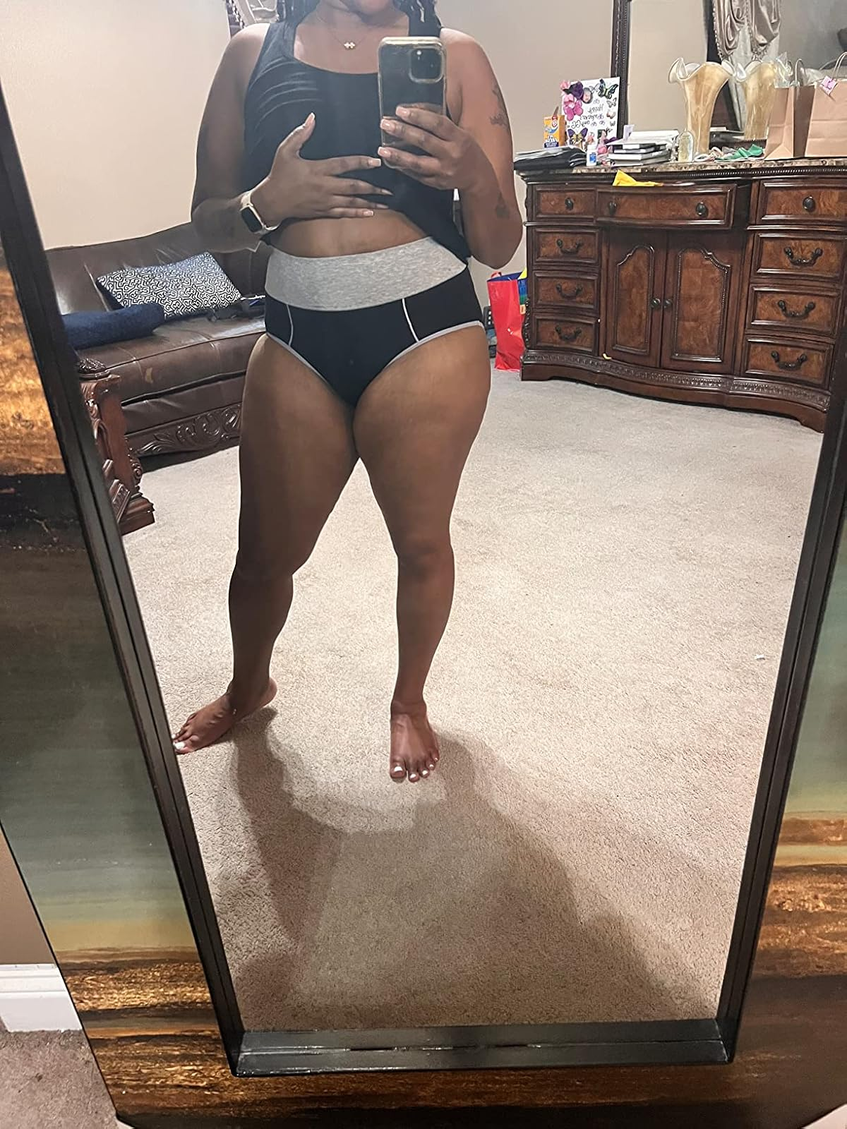 Person successful  a reflector  selfie wears a vessel  apical  and underwear with a supportive waistband, successful  a homely bedroom