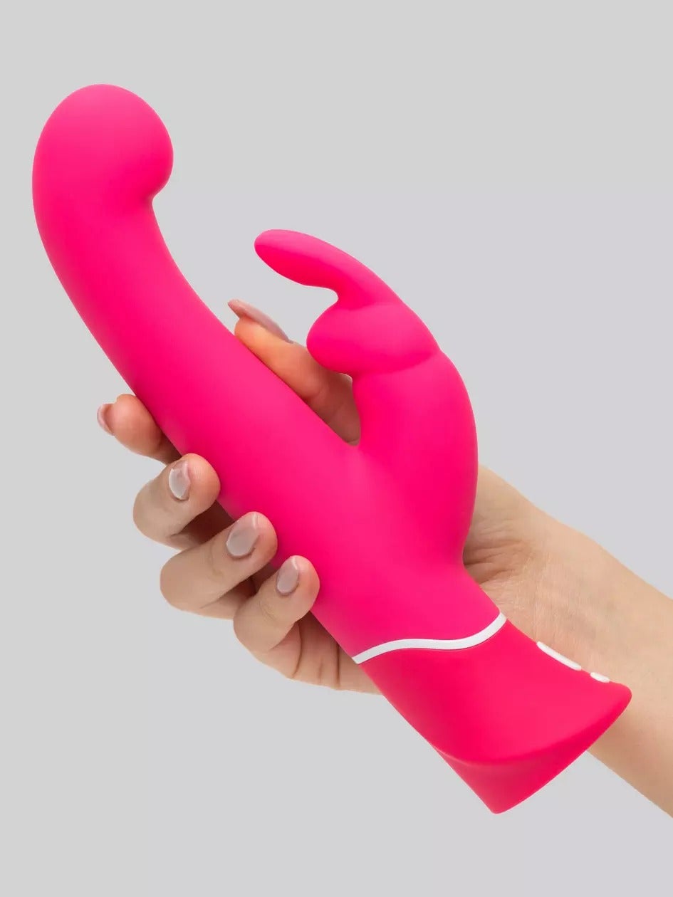 Hand holding pink rabbit vibrator