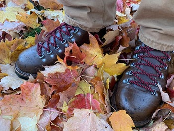 reviewer photo of waterproof boots in wet leaves