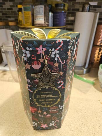 Folkessence 24-day advent calendar with holiday-themed design, featuring assorted  fragrances. Ideal for acquisition  shopping