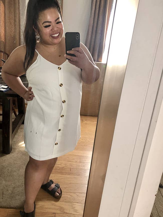 reviewer mirror selfie wearing button-down white dress