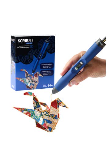 A hand uses a 3D printing pen to create a colorful origami crane, with the product packaging visible in the background