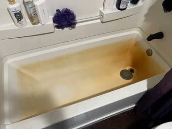 fully hard water stained bathtub