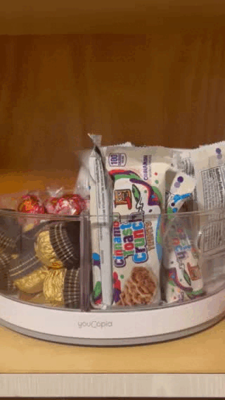 A gif of the turn table spinning around filled with various snacks