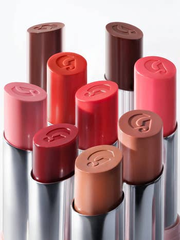 the Glossier Ultralip in red, pink, and brown shades