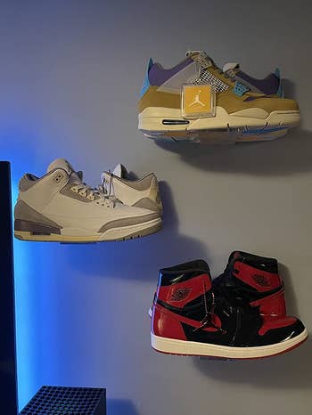 reviewer photograph  of sneakers connected  floating shelves
