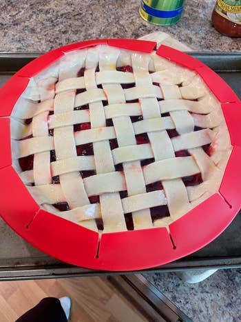 a reviewer's unbaked pie with a red crust cover