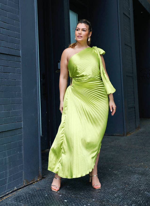 model wearing green asymmetrical midi dress