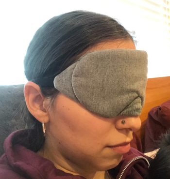 reviewer wearing the mask while sitting upright 