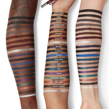 Three arms show  a assortment  of eyeliner swatches with shades labeled, showcasing options from metallics to bold colors for divers  tegument  tones