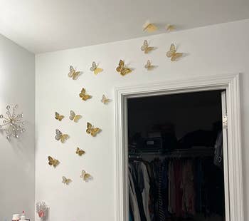 Reviewer's gold butterflies appearing to fly around and above their closet door