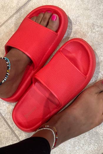 reviewer showing the reddish sandals