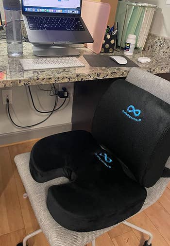the black seat cushion on an office chair