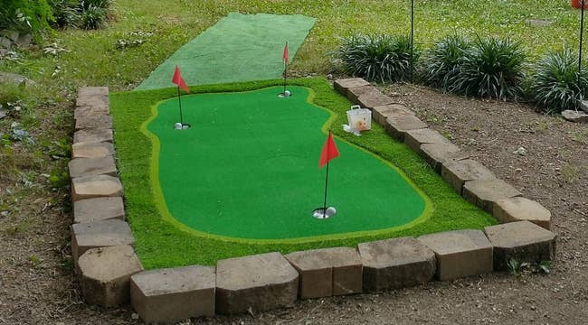 reviewer's mini golf course outside in the backyard
