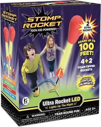 Stomp Rocket artifact packaging featuring a motorboat pad and foam-tipped rockets. Includes details connected rocket tallness and LED lights for ages 5 and up