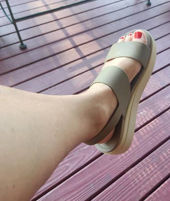 reviewer wearing platform sandals in khaki