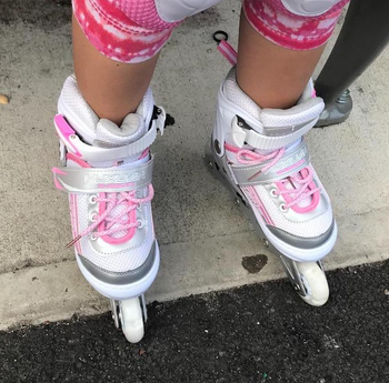 Reviewer image of someone wearing pink and white skates