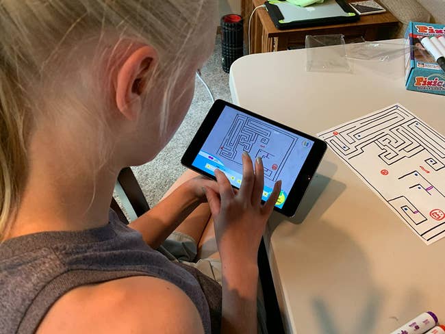 A reviewer's child playing a maze game they created