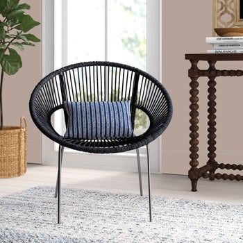 Image of the black chair with a blue cushion