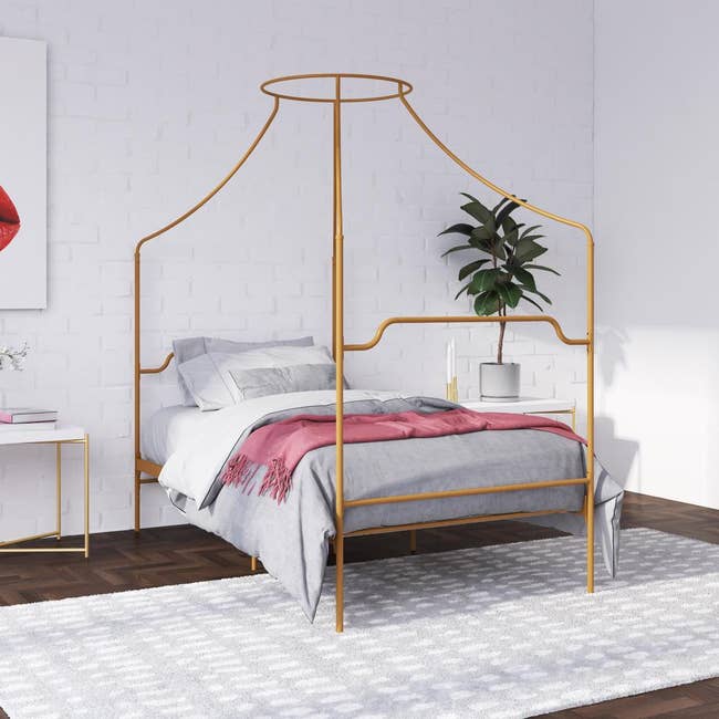 twin bed with gold frame