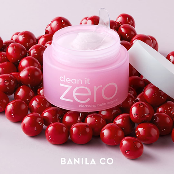 image of pink cleansing balm on bed of red balls