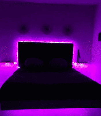 Gif of lights changing colors around a reviewer's bed