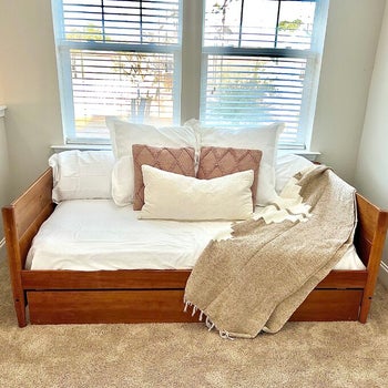 reviewer photo of wooden daybed 