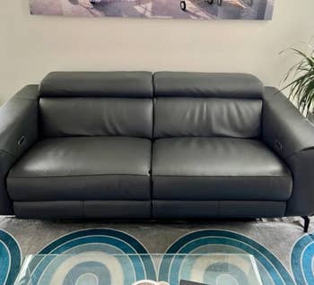 reviewer photo of black leather sofa