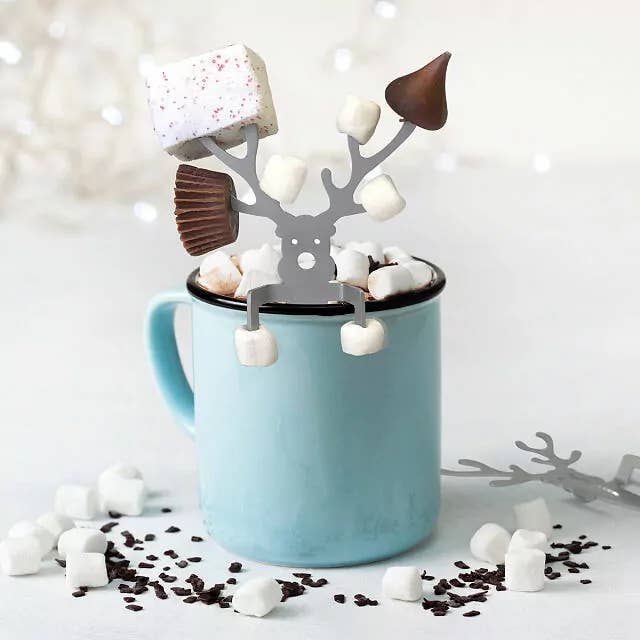 metal reindeer with candy and marshmallows stuck to antlers