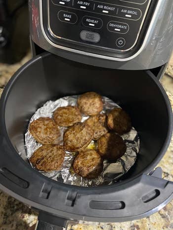 reviewer showing food they made inside the airfryer