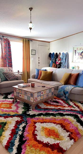 reviewer image of the rug in a living room