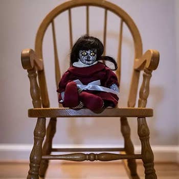haunted doll on a chair