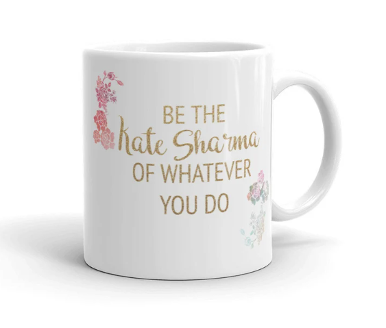 mug with flowers and gold text that says 