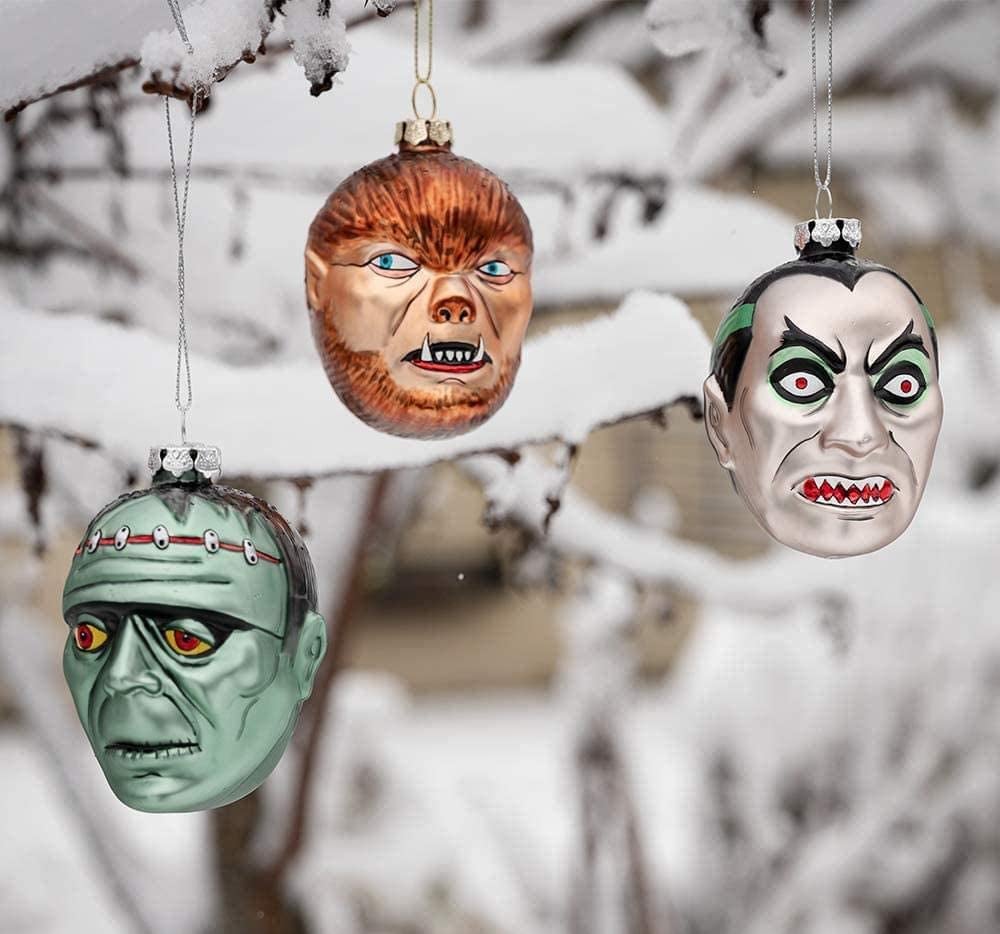  trio of ornaments including Dracula, a Werewolf, and Frankenstein