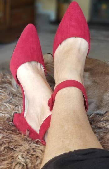 reviewer wearing the red shoes