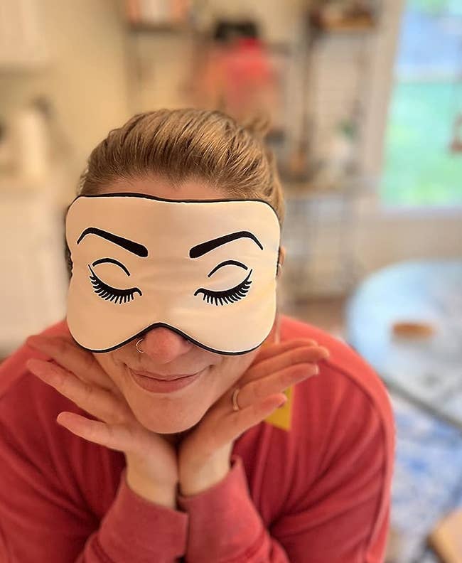 image of reviewer wearing the pink silk eye mask