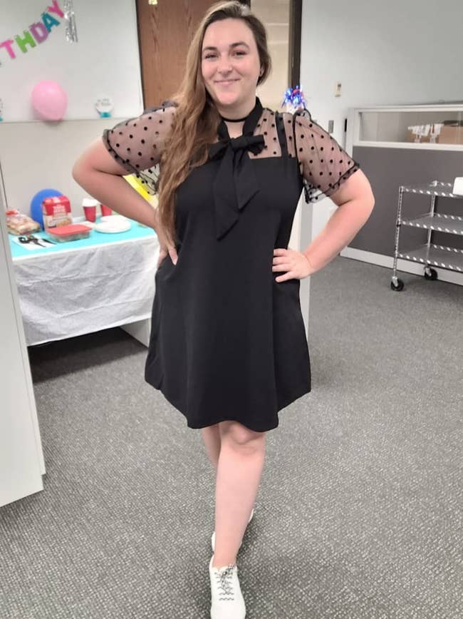 image of reviewer wearing the black contrast mesh dress