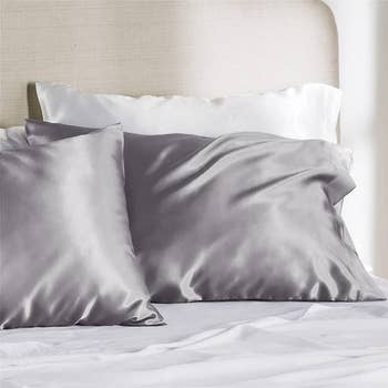 gray satin pillowcases on bed pillows