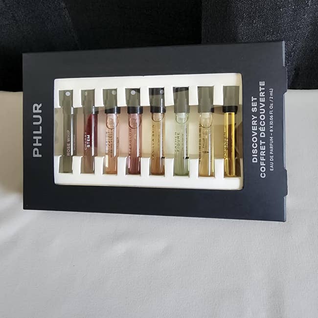 Set of 8  perfume illustration   vials successful  a branded bundle  labeled 