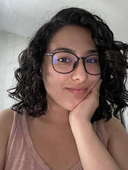 Reviewer with shiny, curly hair