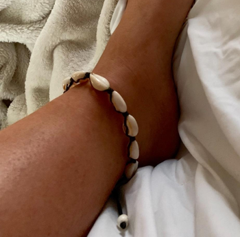 Reviewer wearing the shell anklet