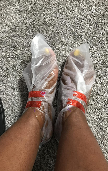 a reviewer with the masks on their feet