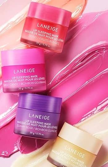 Assorted Laneige lip sleeping masks on a glossy surface, ideal for skincare shopping