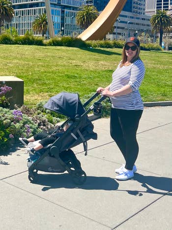 BuzzFeed editor pushing her child in the stroller
