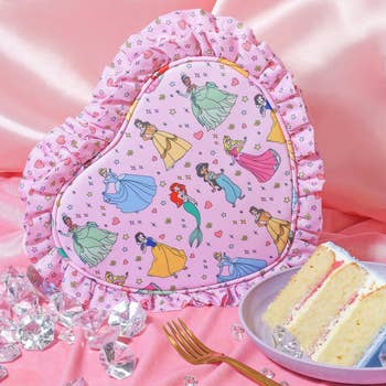 a heart-shaped pouch with frills and a design princess design on it