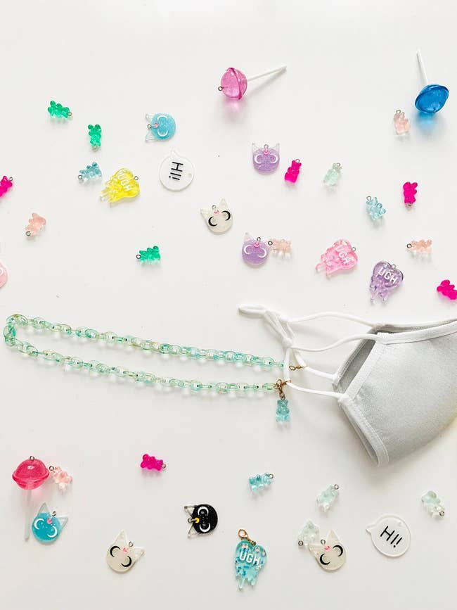 translucent chain surrounded by mini charms like lollipops, gummy bears, and cats