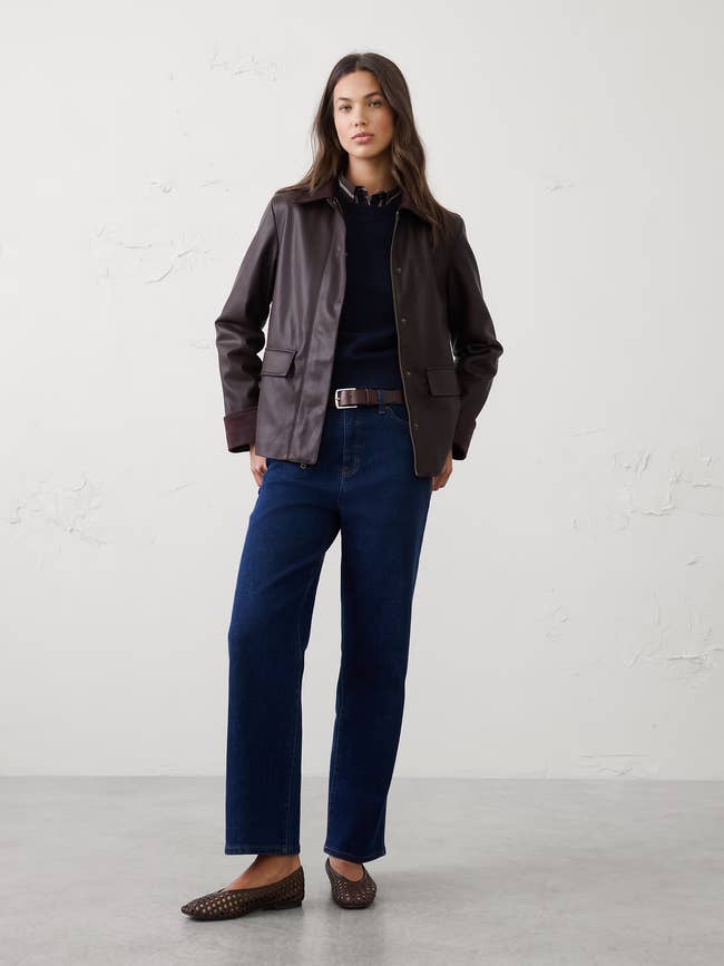 Person wearing a casual outfit with a leather jacket, acheronian  pants, and loafers