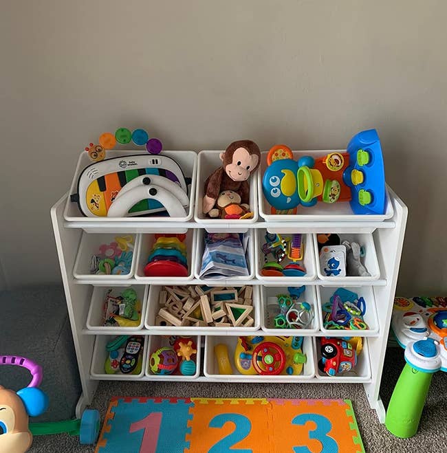 the white toddler storage shelf